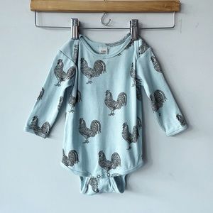 Kate Quinn long sleeve light blue bodysuit. Roosters. Excellent condition.